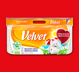 Balení Velvet toaletního papíru na červeném pozadí